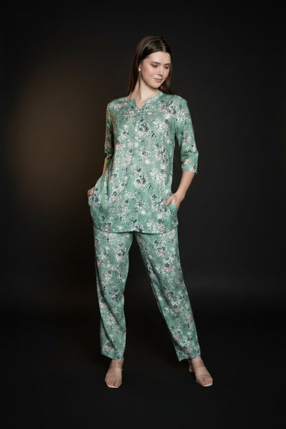 Woman wearing a mint green floral co-ord set with relaxed fit top and matching pants in a stylish indoor photoshoot.
Stylish women’s floral printed lounge wear co-ord set in soft mint green color with comfortable fit.
Premium women floral co-ord set featuring elegant print, breathable fabric, and trendy casual design.
Women pastel green printed top and pant co-ord set perfect for casual wear, travel, and lounging.
Elegant women’s floral night suit style co-ord set with soft fabric and modern relaxed silhoue