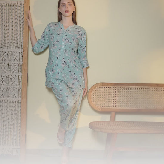 Woman wearing a mint green floral co-ord set with relaxed fit top and matching pants in a stylish indoor photoshoot.
Stylish women’s floral printed lounge wear co-ord set in soft mint green color with comfortable fit.
Premium women floral co-ord set featuring elegant print, breathable fabric, and trendy casual design.
Women pastel green printed top and pant co-ord set perfect for casual wear, travel, and lounging.
Elegant women’s floral night suit style co-ord set with soft fabric and modern relaxed silhoue