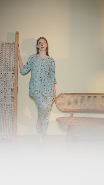 Woman wearing a mint green floral co-ord set with relaxed fit top and matching pants in a stylish indoor photoshoot.
Stylish women’s floral printed lounge wear co-ord set in soft mint green color with comfortable fit.
Premium women floral co-ord set featuring elegant print, breathable fabric, and trendy casual design.
Women pastel green printed top and pant co-ord set perfect for casual wear, travel, and lounging.
Elegant women’s floral night suit style co-ord set with soft fabric and modern relaxed silhoue